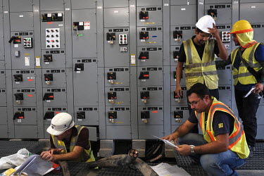 Staff working on the control room's electrics during construction work for the Panama Canal Expansion which will allow ships specified as New Panimax, 320.04m (1,050ft) (l) x 33.54m (110ft) (w) x 12.5...