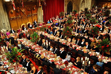 Prime Minister David Cameron making a speech at the annual Lord Mayor's Banquet in London's Guildhall. The Lord Mayor sits to his right. The banquet is attended by law lords, financiers, diplomats and...