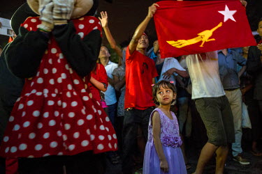 A girl stands amid a crowd waiting for the announcement of the results of the 2015 general election in front of the National League for Democracy (NLD) headquarter in Yangon.