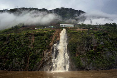 Water from a private hydro-power station runs into the Nujiang River.