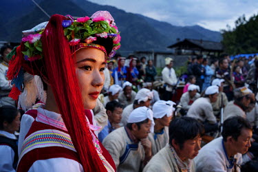 Men & women from nearby villages, dressed in traditional Nu and Tibetan costumes, wait to go on stage at the annual Fairy Festival where local Nu, Tibetan and Lisu minorities dance and perform.