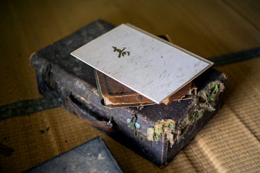An old suitcase in the house of a rice farmer in Itate village abandoned following the 2011 Fukushima Daiichi nuclear disaster. On 11 March 2011 a magnitude 9 earthquake struck 130 km off the coast of...