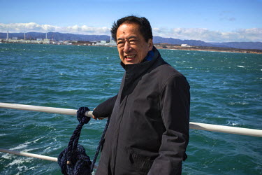 Naoto Kan (Prime Minister of Japan during the Fukushima nuclear accident) on board the Greenpeace Rainbow Warrior sailing off the coast of Fukushima calling for the closure of all nuclear reactors in...