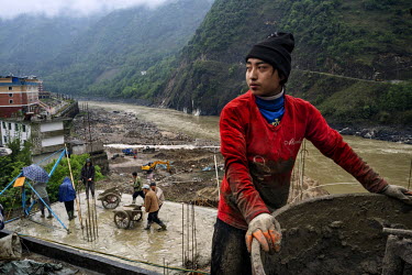 Lisu day labourers working on a construction project beside the Nujiang River.