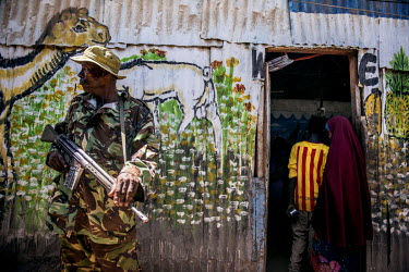 A security guard stands outside a restaurant in Dadaab refugee camp.