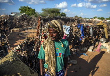 Maalin Hassan, a former farmer from Dinsor, Somalia, outside his shelter in Dadaab refugee camp.