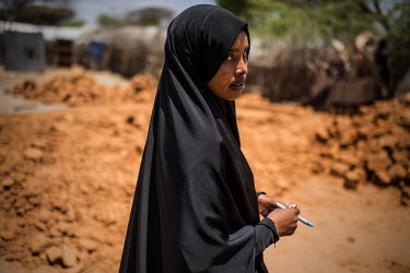 Brownkey Abdullahi, a 23 year old Somali refugee, outside her home in Dadaab refugee camp. Brownkey has lived her entire life in the camp.
