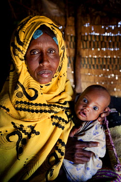 Habodo Gele age 35, with her baby Hodon, 14 weeks old, and her son Samod, aged five, at ther home.  A devastating drought is causing the worst food crisis to hit Ethiopia in 30 years, putting millions...