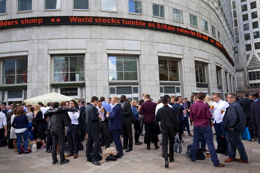 Office workers, many of whom are employed by the many banks headquartered in Canary Wharf, gather for a drink after work on 24 June 2016, the day after the country voted (by 52 to 48 percent) to leave...