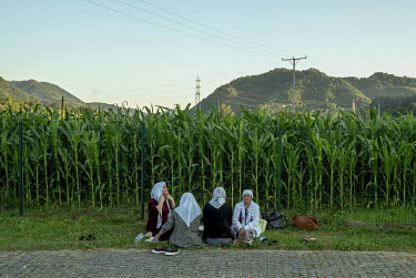 Women sit in the Srebrenica memorial centre near the battery factory in  Potocari, where Serb forces overran the Dutch Peacekeepers tasked with protecting the UN safe haven of Srebrenica on the 21st a...
