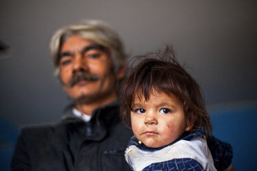 Rudolf (52) with his granddaughter. They are from a Roma family who have joined a pilot project called 'From Shack into a 3E (Ecological and Energy Efficient) House' constructing low-cost houses for t...