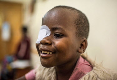 Chriscent Bwambale undergoes an eye test after a cataract operation. Criscent was born with cataracts in both eyes, able only to distinguish areas of light and dark. In Uganda, where there is little s...