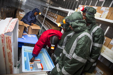 Medecins Sans Frontieres (MSF) staff pack coolers with yellow fever vaccines, which must be kept at between 2 - 8 degrees Celcius, in preparation for a massive immunisation campaign.