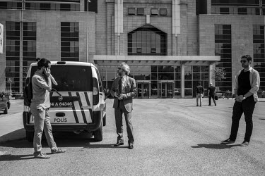 Can Dundar, the editor-in-chief of the national newspaper 'Cumhuriyet' (Republic), outside the city's court house with his security men. They have been a constant presence following an assassination a...