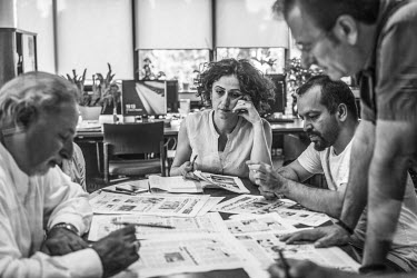 Can Dundar (left), the editor-in-chief of the national newspaper 'Cumhuriyet' (Republic), deciding on stories and the layout for the next edition in the newspaper's offices. Dundar was charged with tr...