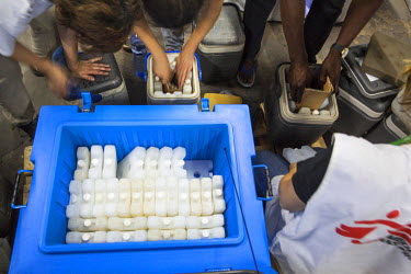 Medecins Sans Frontieres (MSF) staff load icepacks into coolers, to keep yellow fever vaccines at between 2 - 8 degrees celcius, as final preparations are made for a massive immunisation campaign.