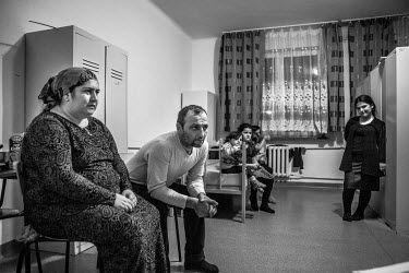 A family of Chechen refugees who live in a refugee shelter.