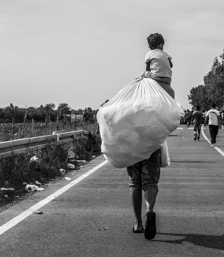Refugees walk towards the Croatian border after Hungary closed its border with Serbia.