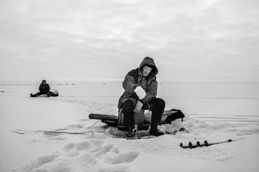 Roman, a worker at a thermal power station in Narva, on an ice fishing trip on Peipsi Lake.