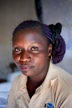 Janet Awino (39) in Highridge village, Korogocho, Nairobi. She is a Community Health Volunteer and has six children - three girls and three boys.