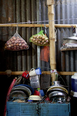 Domestic items and food at the home of Moyna Begum at her home in Jhilpaar area, Mirpur. Moyna started a business making and selling clothes, having received training from Concern.