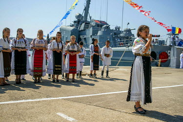 Youths from a folk orchestra singing patriotic songs on Navy Day, an annual event where the navy opens up various of its facilities to the public who are free to come and examine equipment and weapons...