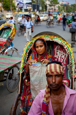 Nazma in the rickshaw she uses to deliver food, made at her home in Naya Paltan, to customers working in local offices.