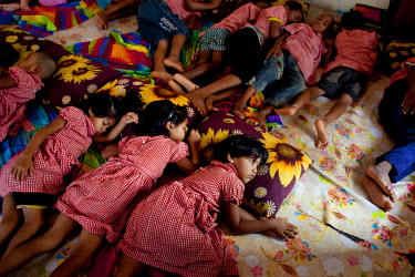 Children sleeping at the Manik Nagar PDC (Pavement Dwellers' Centre) in Dhaka, Bangladesh.