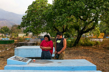 Angelica Choc and her son Joseph Ich Choc pray at the grave of former Q'eqchi' Mayan community leader, teacher and anti-mining activist Adolfo Ich Chaman, Angelica's husband and Joseph's father. Ich C...
