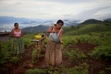 Olivia Asig Xol, one of the eleven plaintiffs in the Caal vs. HudBay legal case in Canada, washes corn kernels. The Q'eqchi' Mayan community of Lote 8 was violently evicted on 17 January 2007, by stat...