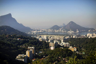A view from Rocinha of Zona Sul's wealthy neighbourhoods of Gavea and Lagoa. To the left is the statue of Christ the Redeemer.