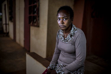 Aissata Barry in the stands at the national stadium where she was raped by soldiers during the massacre of 28 September 2009.'I was held in the stadium and raped there in the stands. They hit me on th...