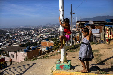 Children play at the Palmeira cable car station in Complexo do Alemao in the North Zone.