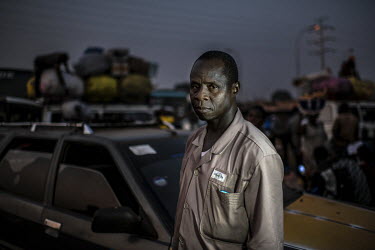 Oumar Sow in the Madina taxi park where his brother was shot dead by the security forces in 2007.'It was the time of the general strike in Guinea. He said he wouldn't be gone long. Suddenly a group of...