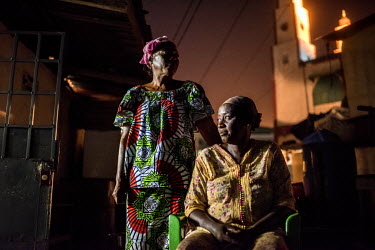 Mamaissata Camara (left) outside the house where she lived with her sister Habibatou Camara after the two of them were raped at the national stadium during the massacre of 28 September 2009.'I left my...