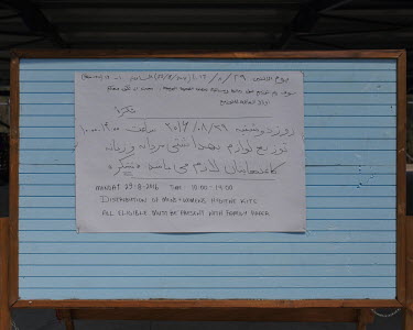 A noticeboard in the Leros 'Hotspot', an EU-run migrant's reception centre opened in the grounds of the former Lepida psychiatric hospital, advertising, in ARabic and English, the distribution of hygi...