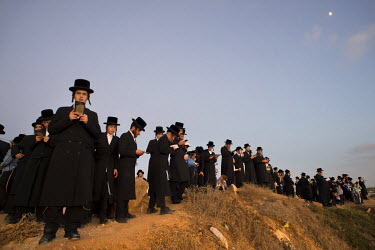 Ultra-Orthodox Jewish men pray during a 'Tashlich' ritual beside the Mediterranean Sea. 'Tashlich' ('to cast away') is a ritual where believers go to a flowing body of water and symbolically 'throw aw...