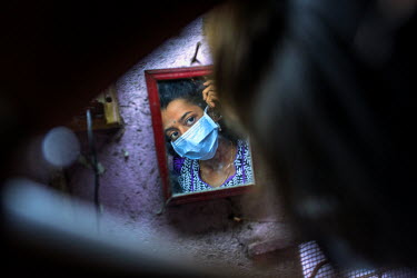 XDR-TB patient Nischaya, at home in the Ambedkar Nagar area of Mumbai.  Nischaya (not her real name) is 18 years old, lives in Mumbai, and is one of only a handful of extensively drug-resistant TB (XD...