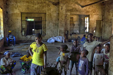 Internally Displaced People (IDPs), ethnic Twa pygmies, living in an abandoned Belgian colonial-era cotton factory. Around 200 people live in the old factory building after they were forced to move fr...