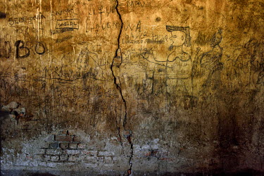 Grafitti in an abandoned Belgian colonial-era cotton factory now home to round 200 ethnic Twa pygmy Internally Displaced People (IDPs) who were forced to move there from their village, Mukomena. The c...