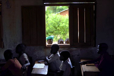 Children look into a classroom in a school in Muhuya. The conflict in Katanga, a vast province known for its rich deposits of copper and valuable metals, pits the Luba, a Bantu ethnic group, against t...