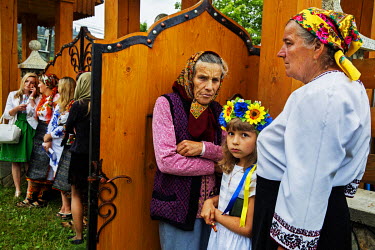 A family on their way to the Orthodox Church for the annual village celebration.