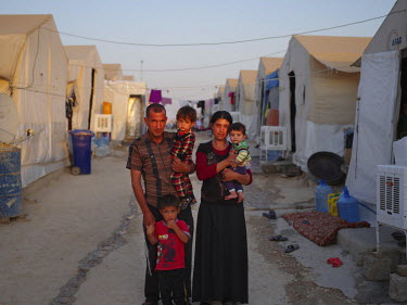 A Yazidi family living in Sharia camp. Haydar, 40, the father said: 'I was working as a cleaner at clinic in Sinjar. I got married to my wife Kamal in November 2013. When ISIS attacked my village Zora...