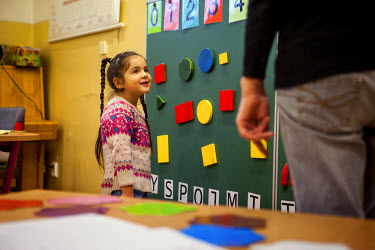 Esther Kroscenova, six, takes an enrollment examination for the ZS Chrustova elementary school, where Roma and non-Roma children are educated together. She is being asked about numbers, colours and le...