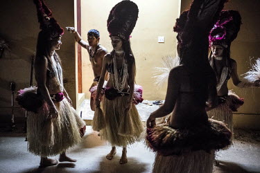 Performers prepare for a Micronesian cultural show at the Fiesta Resort and Spa. In 2015 Typhoon Soudelor, the worst storm in 30 years, destroyed much of the island's tourist infrastructure, so vital...