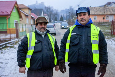 Two members of the 'Roma Civil Guard' in the Roma part of Podsadek.
