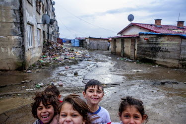 Children at the entrance to the Roma settlement on 'Budulovska Street' a segregated community where around 800 people live.