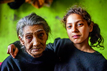 Maria (85), the oldest inhabitant of the segregated Roma settlement on 'Budulovska Street', with 11 year old Celestina.