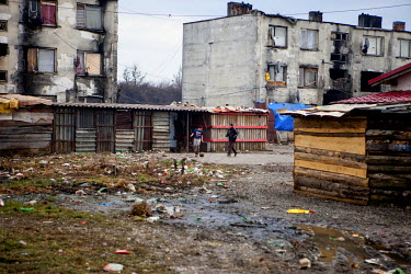 Two boys playing football in the Roma settlement on 'Budulovska Street', a segregated community where around 800 people live.