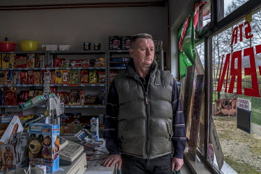 Fikret Bacic in the shop he runs from  his home. 29 members of his extended family were taken by Bosnian Serb forces and killed in July 1992. He is still searching for the remains of most of them.